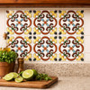 Talavera relief scroll medallion tile installed as a kitchen backsplash adding depth and color