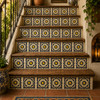 Mexican relief tile yellow medallion floral decorating stair risers with bold talavera floral design