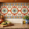 Symmetrical medallion talavera relief tile installed as a kitchen backsplash adding depth and handcrafted character