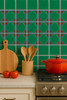 Mexican talavera relief tile emerald used in a kitchen space with vivid sculpted relief accents