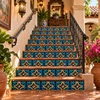 Relief talavera tile with blue and gold design decorating Mexican hacienda stair risers