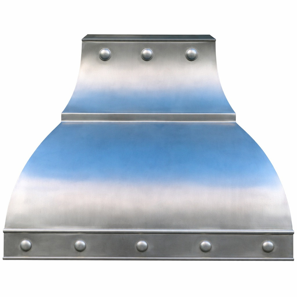 Custom architectural zinc range hood with riveted detail and flared canopy