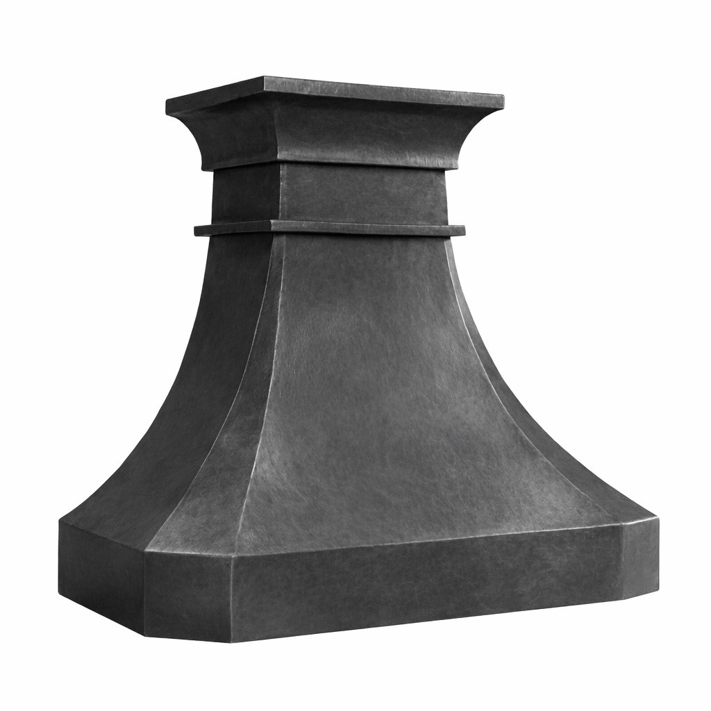 Side view of dark hammered zinc range hood with tiered crown and tapered canopy