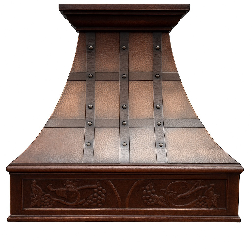 Decorative copper kitchen range hood front view, hammered copper canopy with dark riveted straps and carved grapevine apron detail
