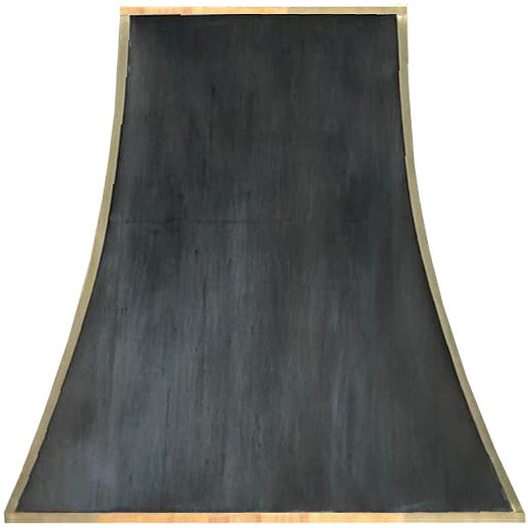 Sculpted black zinc range hood with copper straps