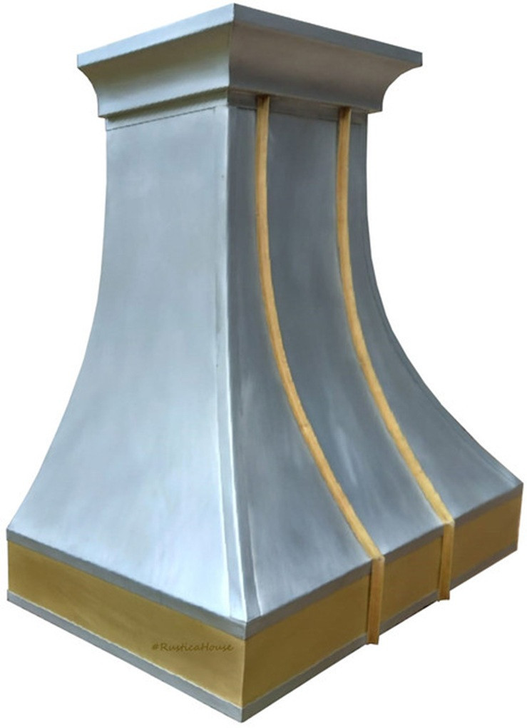 Custom zinc and brass metal range hood shown angled view, smooth zinc panels with brass apron and riveted straps visible