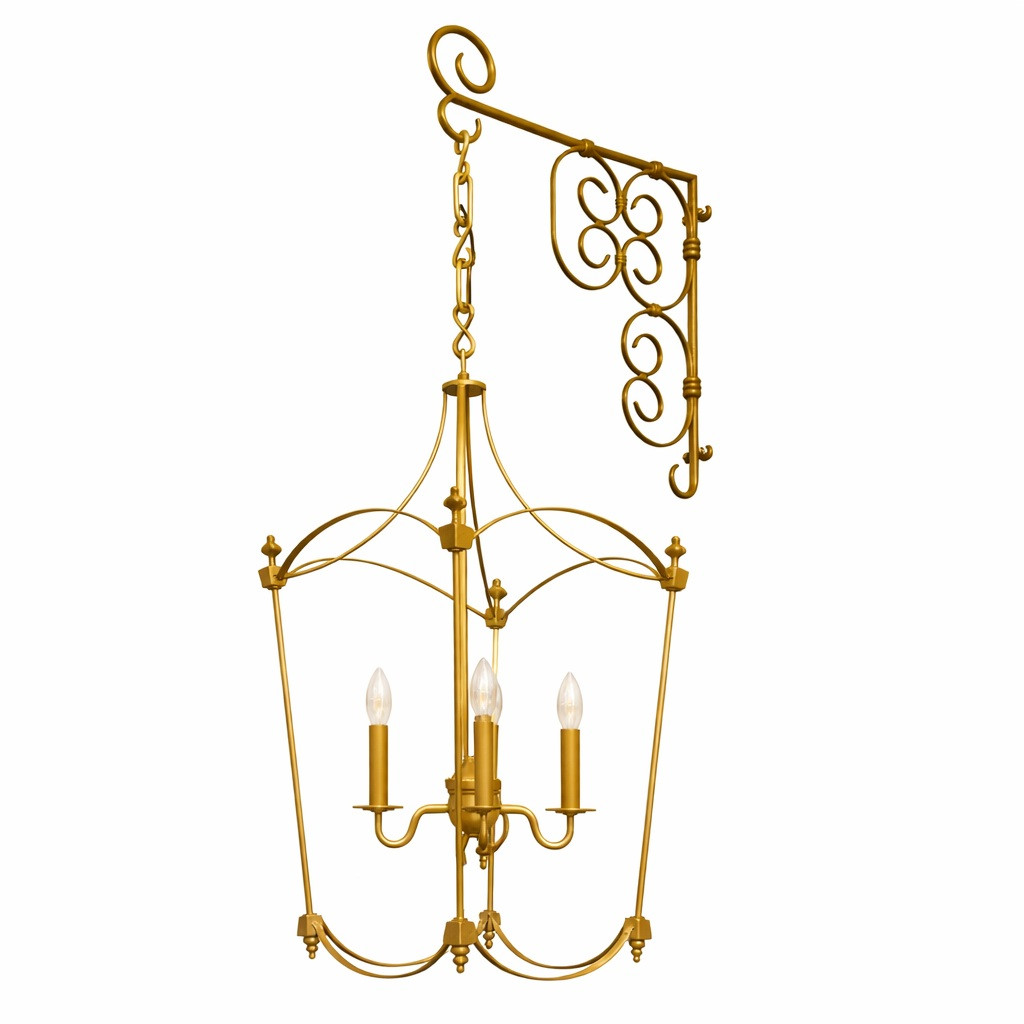 French Provincial brass wall lantern with ornate scroll bracket