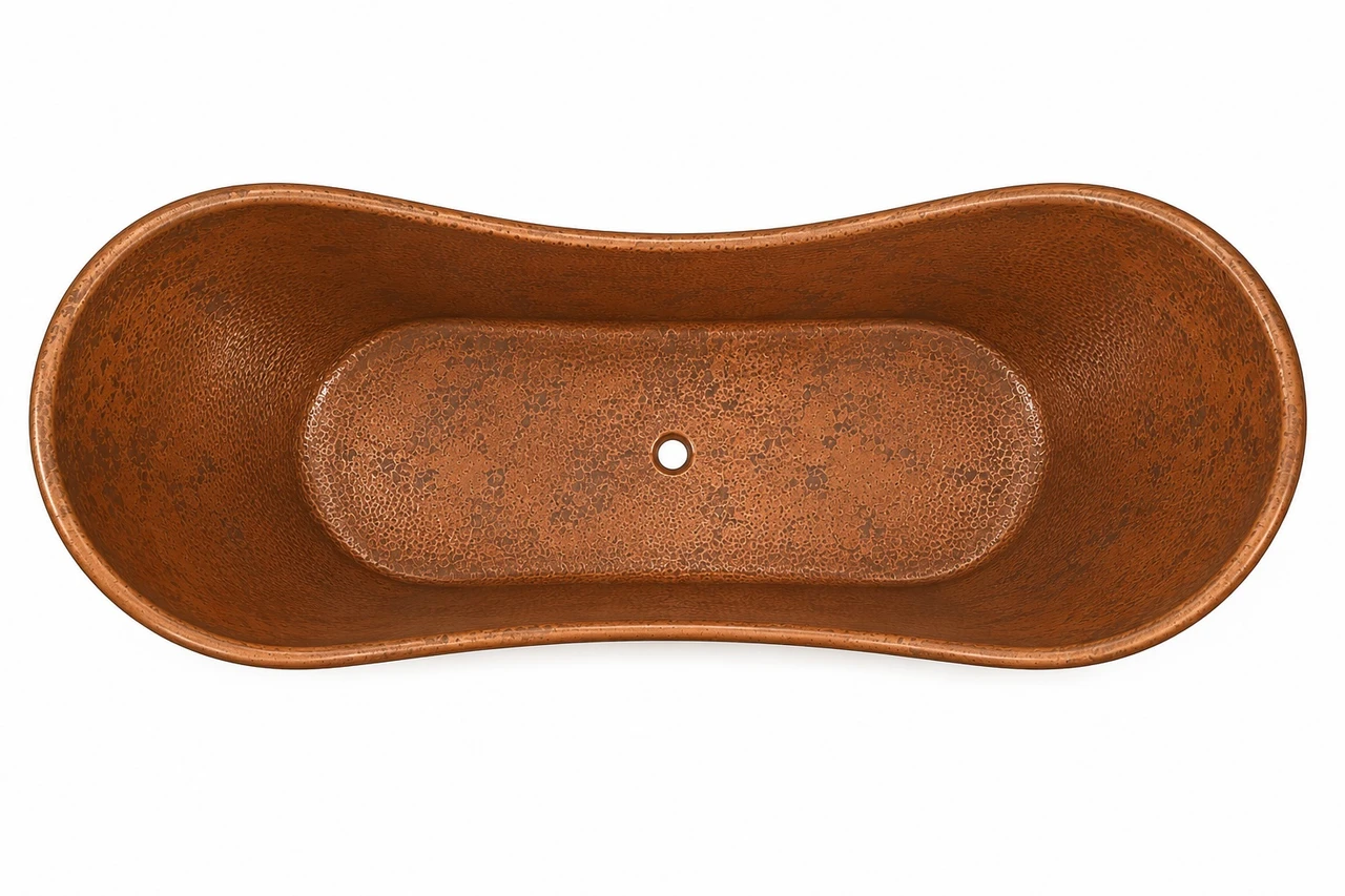 Hand hammered double slipper copper bathtub for two, top view showing hammered interior and centered drain opening