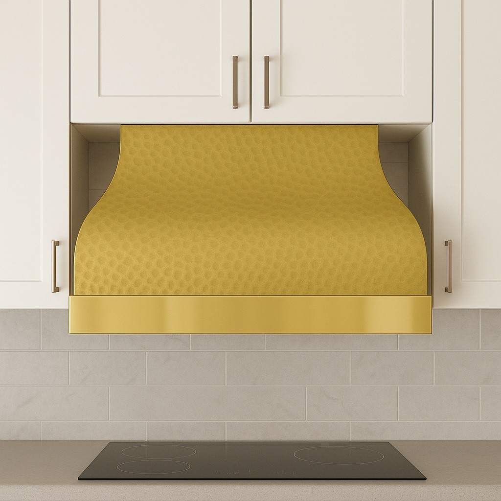 Undermount vintage brass range hood in a modern style kitchen