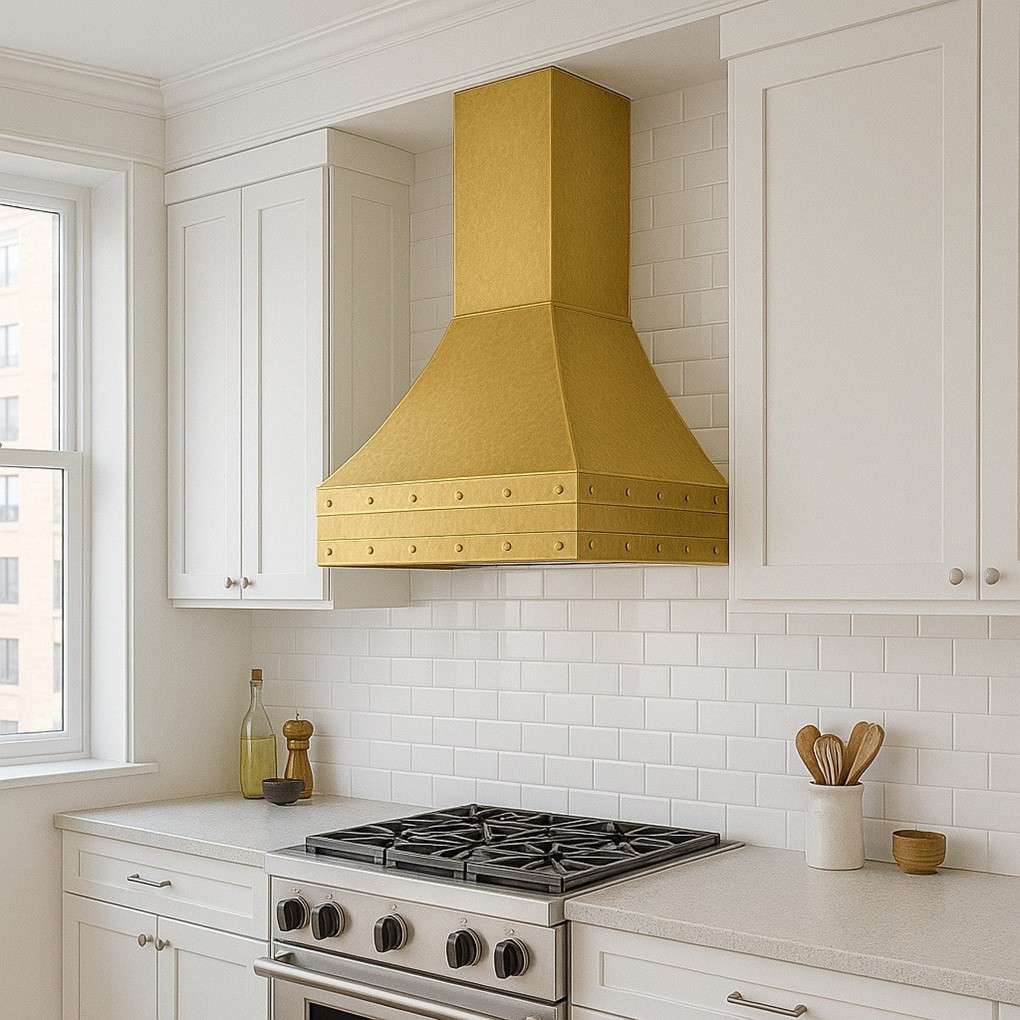 Rustic brass range hood in an apartment kitchen, wall mounted above the stove with warm industrial accents