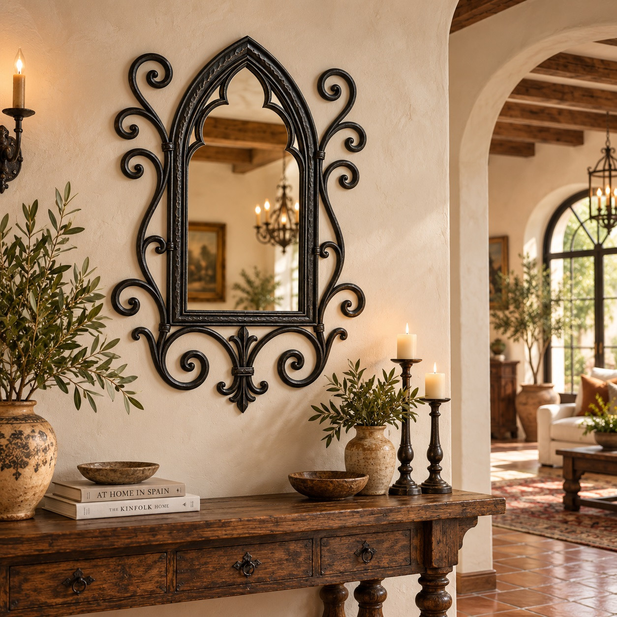 Gothic wrought iron mirror with quatrefoil tracery in a Spanish-inspired interior space