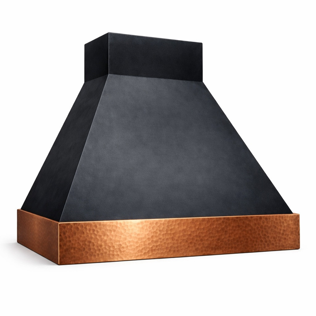 Side view of a zinc range hood with a hammered copper apron highlighting its mixed-metal craftsmanship and warm contrast