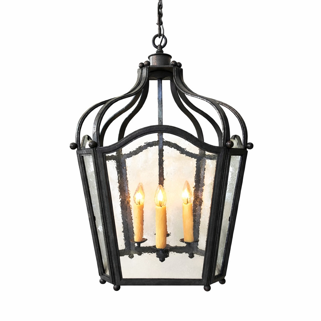 French country iron lantern pendant with rustic glass and lights on