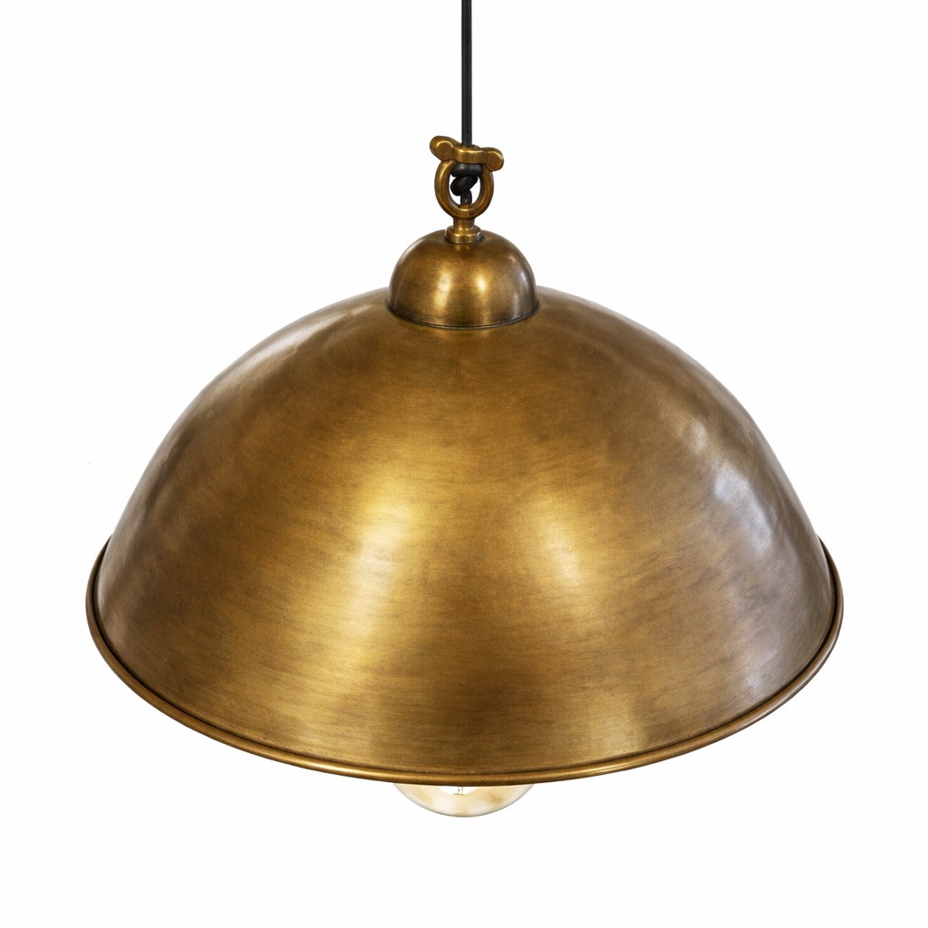 French inspired brass dome pendant lamp with warm patina shown at angled view, wide low dome shade with rolled rim and soft highlights