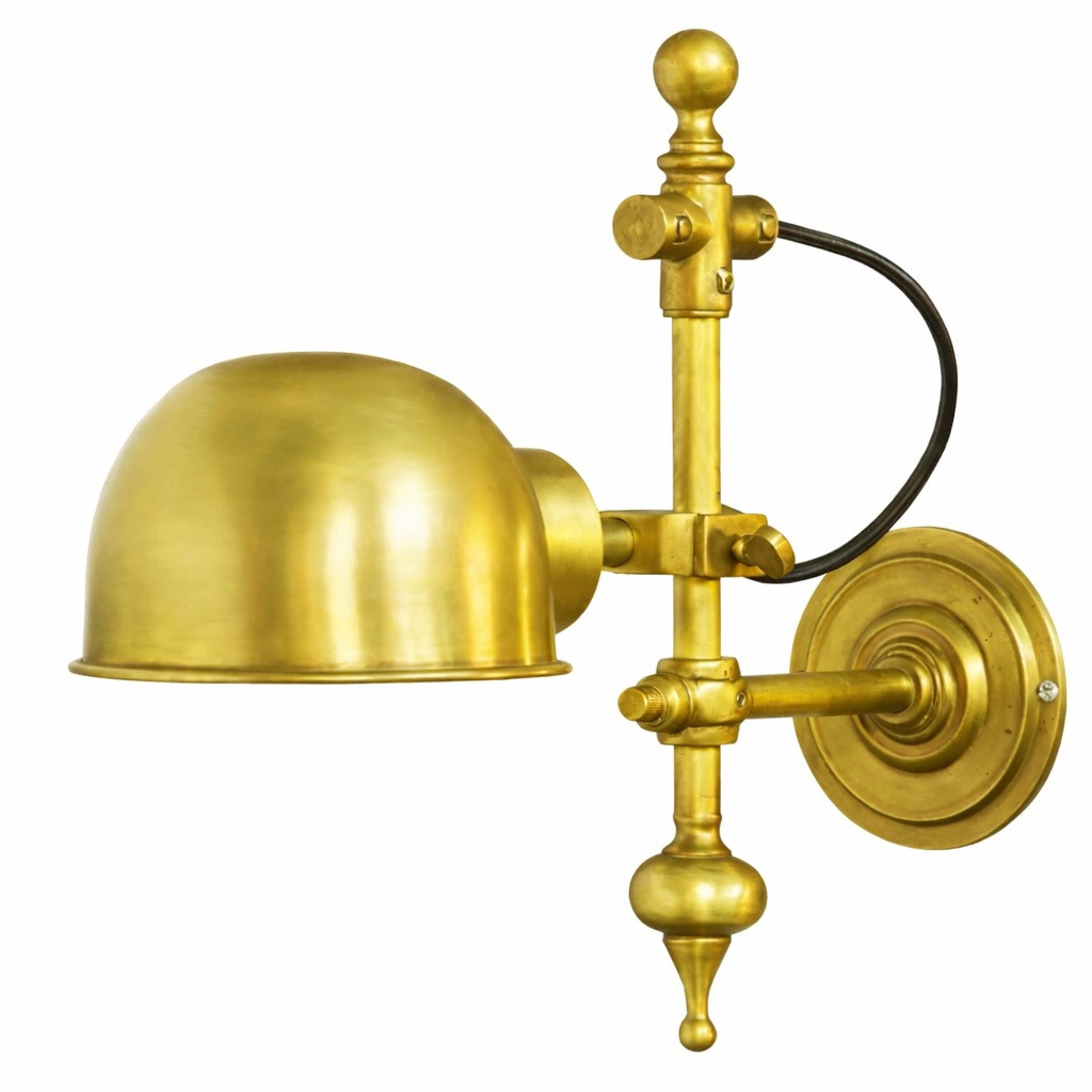 Industrial brass wall lamp with single wall plate in honey golden finish, dome shade and exposed joints casting focused downlight