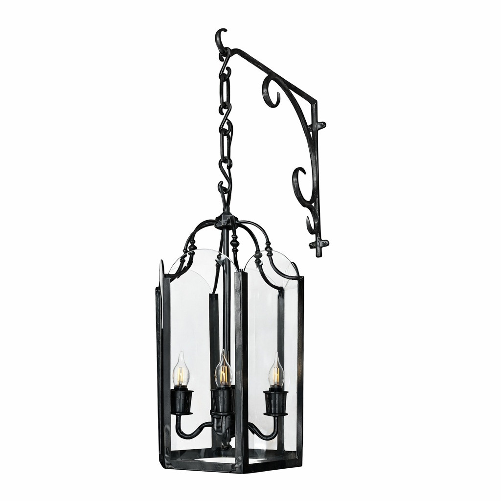 Traditional brass lantern chandelier with scroll bracket in rustic black finish, clear glass and three candle lights for hospitality spaces