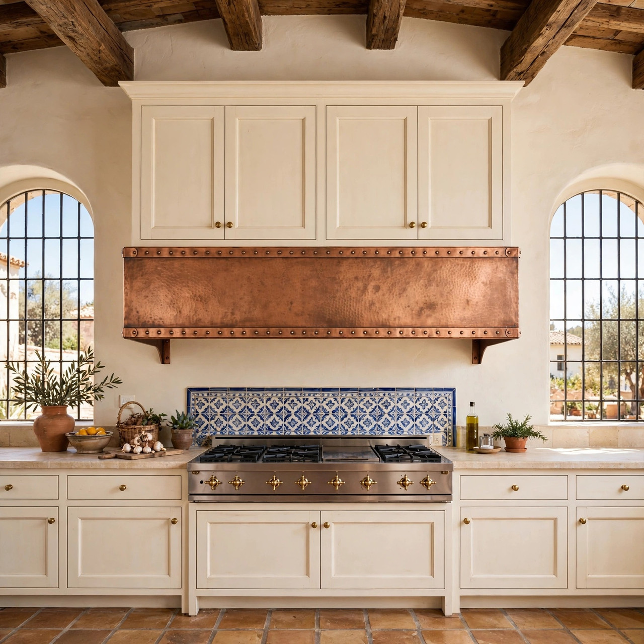 Industrial Tuscan kitchen with hammered copper under-cabinet box hood and riveted metal bands