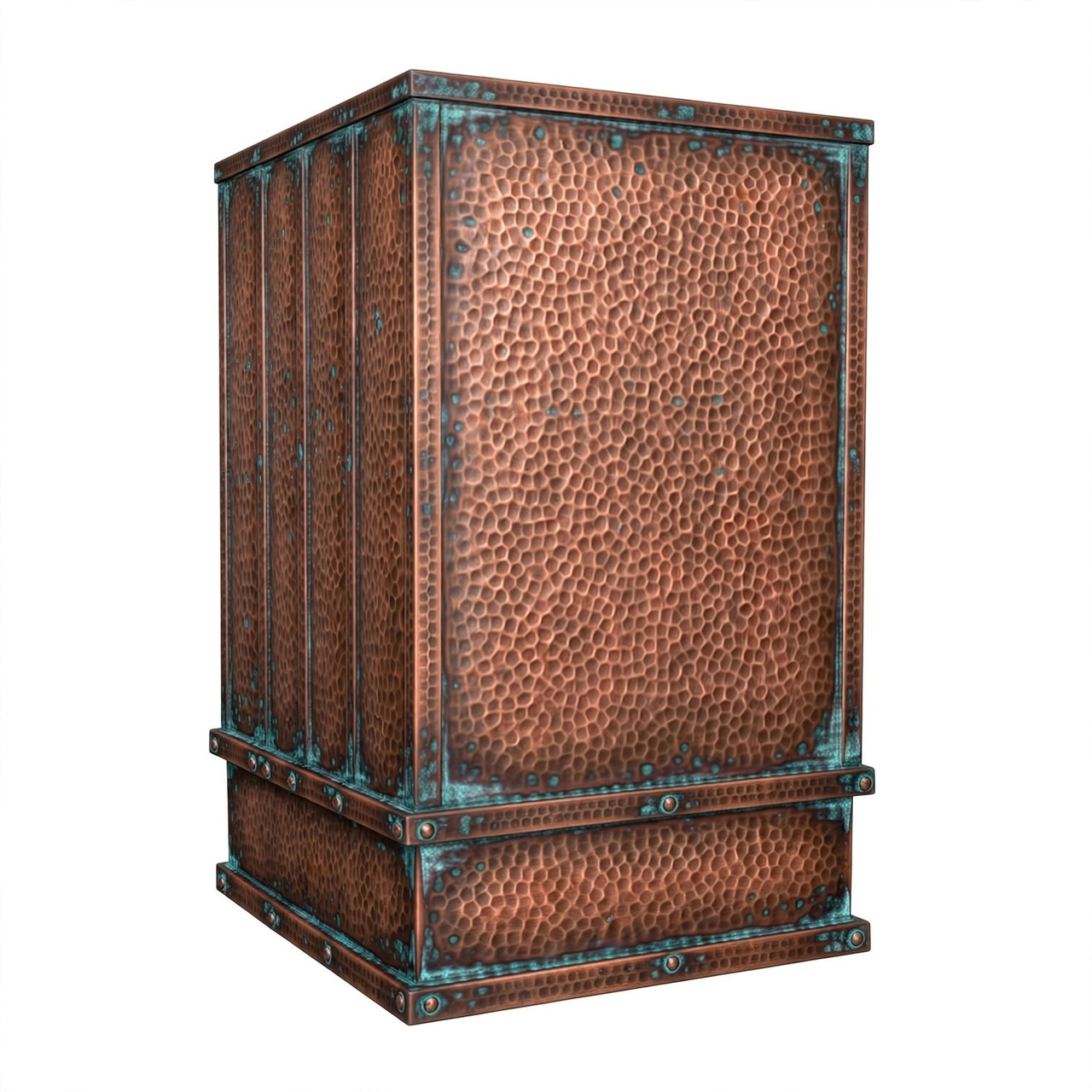 Angled view of hammered copper tower range hood with verdigris straps, tall chimney, and weathered patina