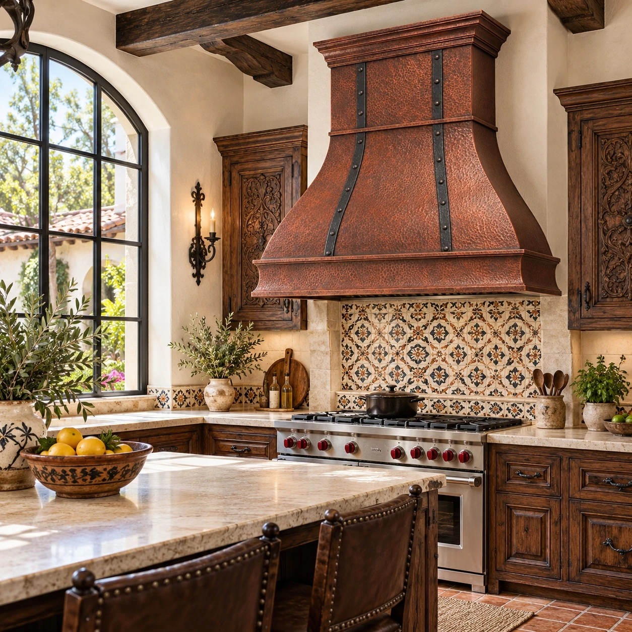 Spanish Colonial kitchen with bell copper range hood, forged iron straps, and stepped crown