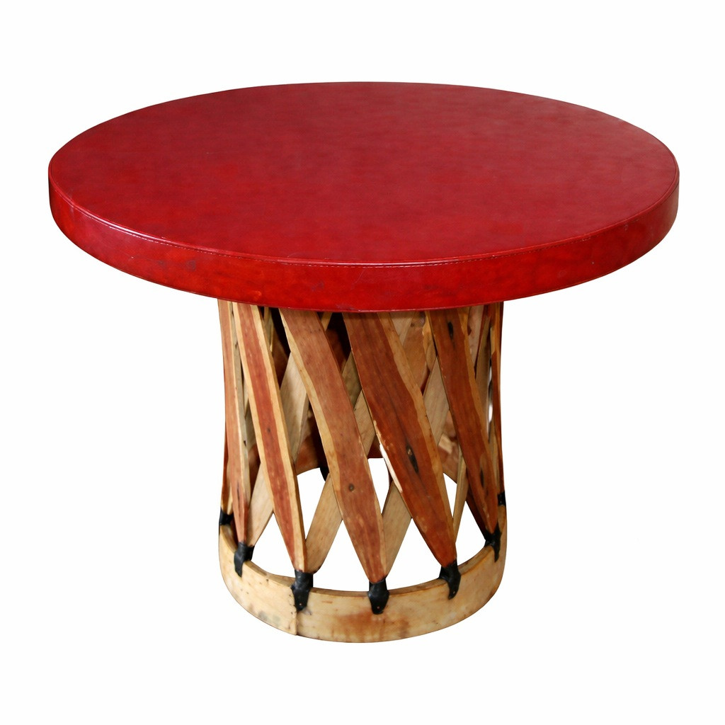 Round equipal table with a red terra cotta pigskin top