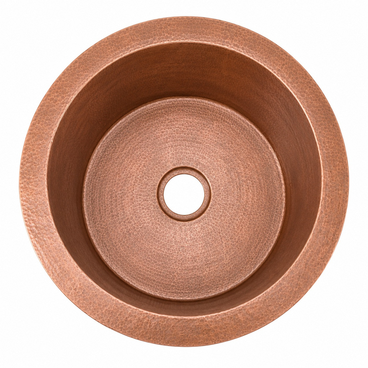 Round hammered copper bar sink viewed from above with centered 3 1/2 inch drain opening and circular basin