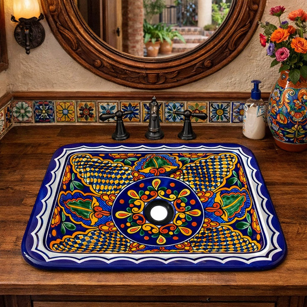 Hand painted rectangular talavera bathroom sink blue floral installed in Mexican hacienda bathroom with colorful decor