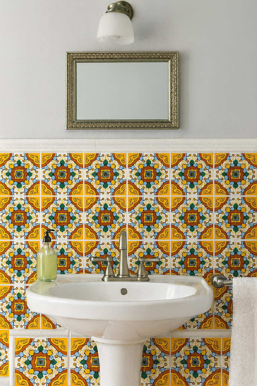 Yellow red medallion talavera tile used above a bathroom vanity highlighting Mexican handcrafted design
