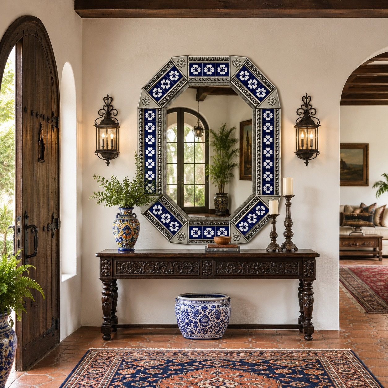 Octagonal decorative tin mirror with blue talavera flower tiles displayed in a Spanish Revival entry hall