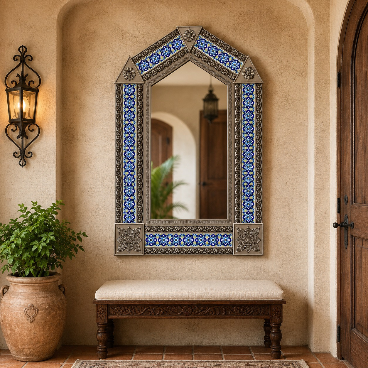 Handcrafted arch tin mirror with floral talavera tilework on warm plaster accent wall