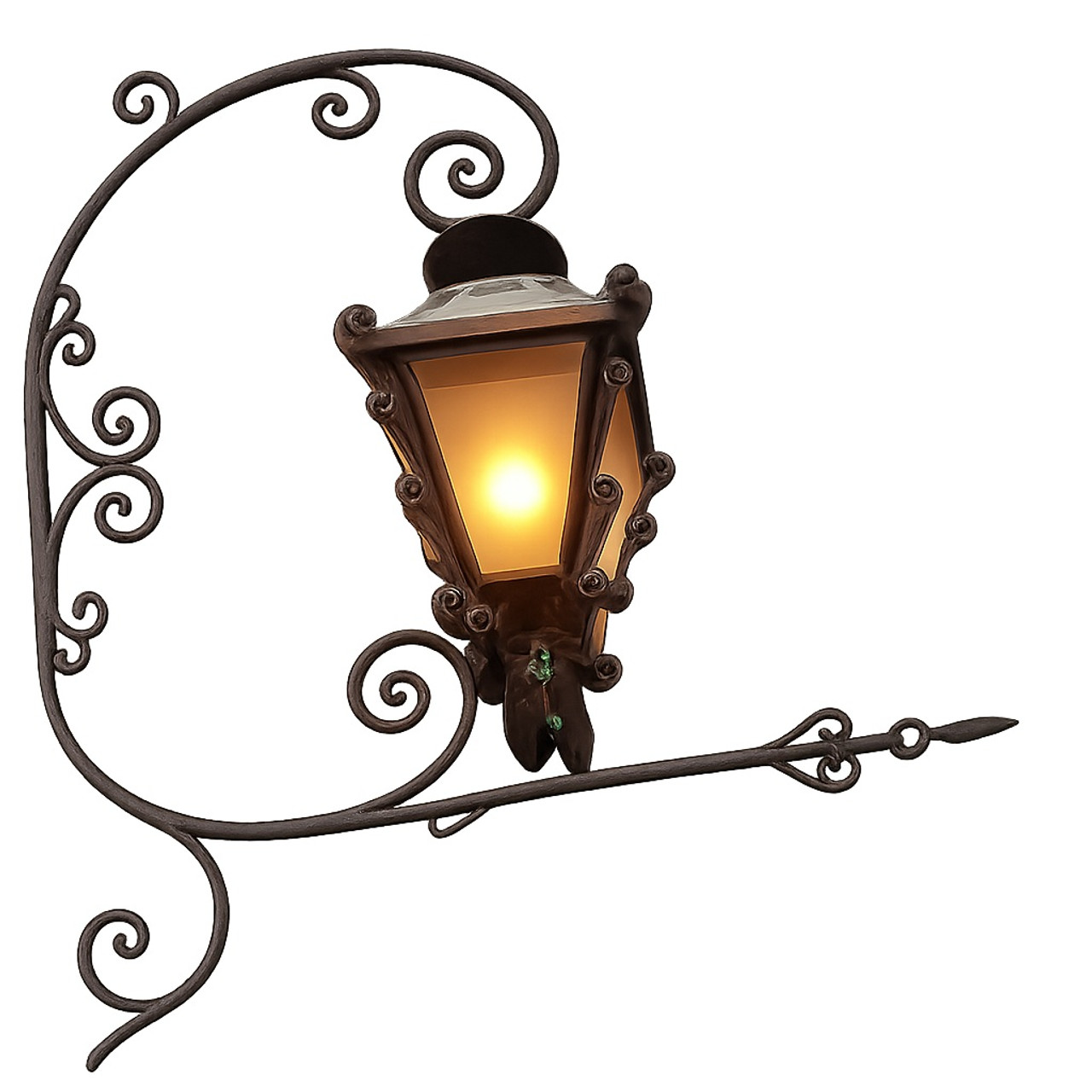 Wrought iron wall lantern with C-scroll bracket and arrow finial with the lamp on