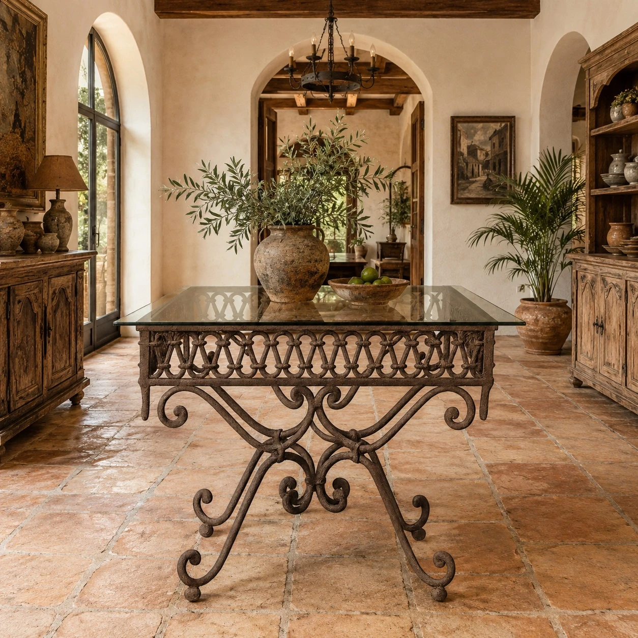 Spanish colonial style wrought iron table base with glass top in a hacienda dining room