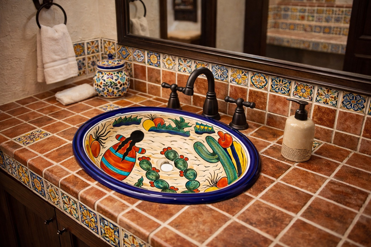 Mexican desert folk art sink displayed in a Spanish Revival bathroom with warm tile and rustic finishes