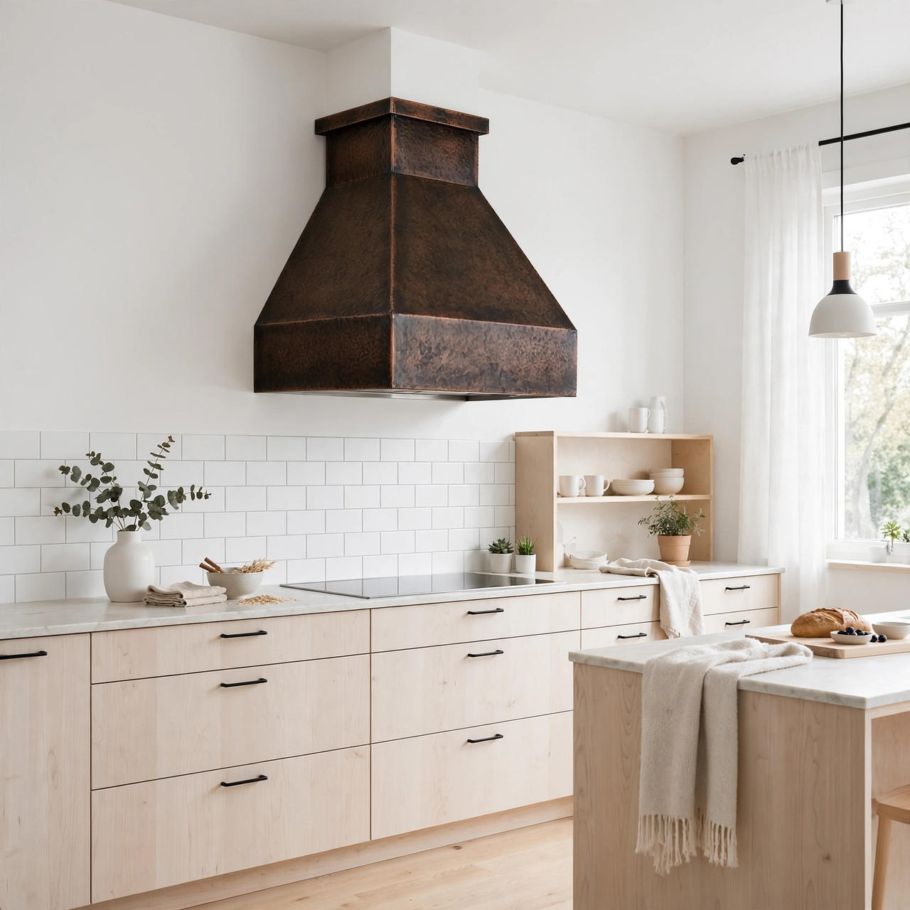 Scandinavian modern kitchen with minimalist trapezoidal copper range hood and clean profile