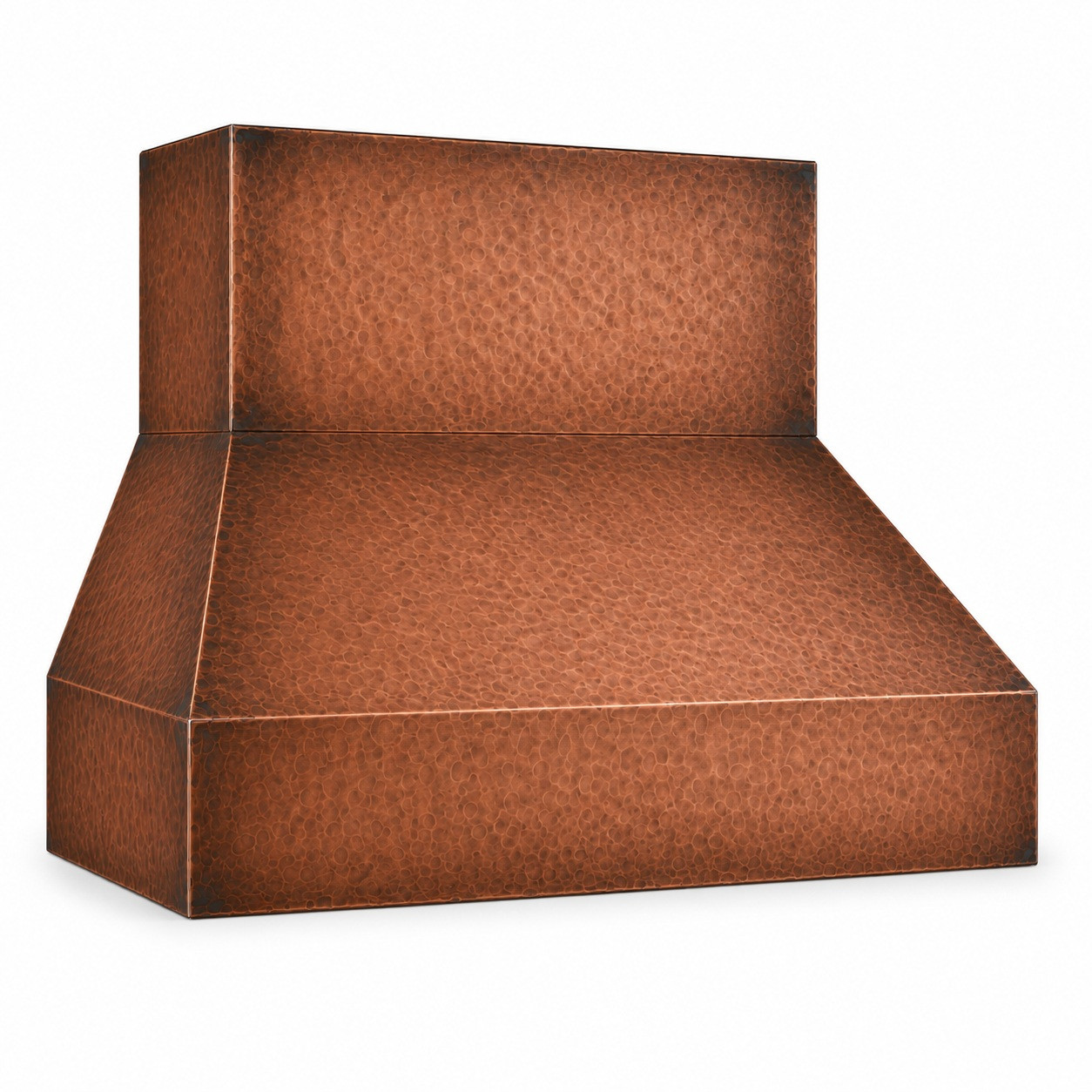 Close-up detail of wide-chimney under-cabinet copper range hood highlighting hand-hammered texture and darkened corners