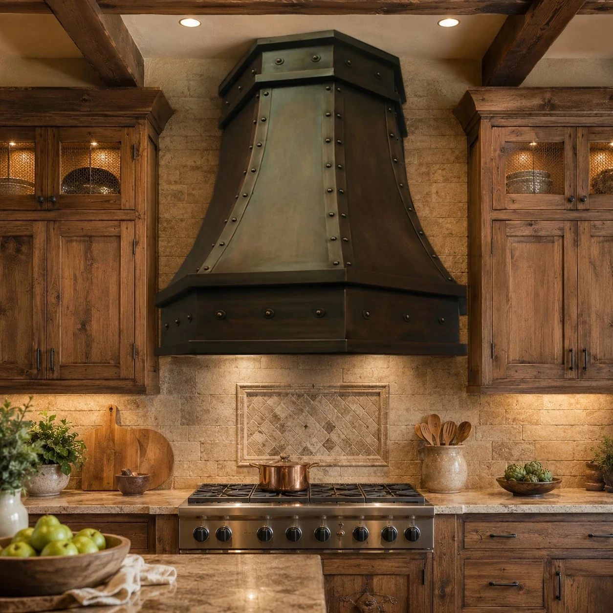 Hacienda kitchen with faceted copper island range hood, riveted straps, and warm patina