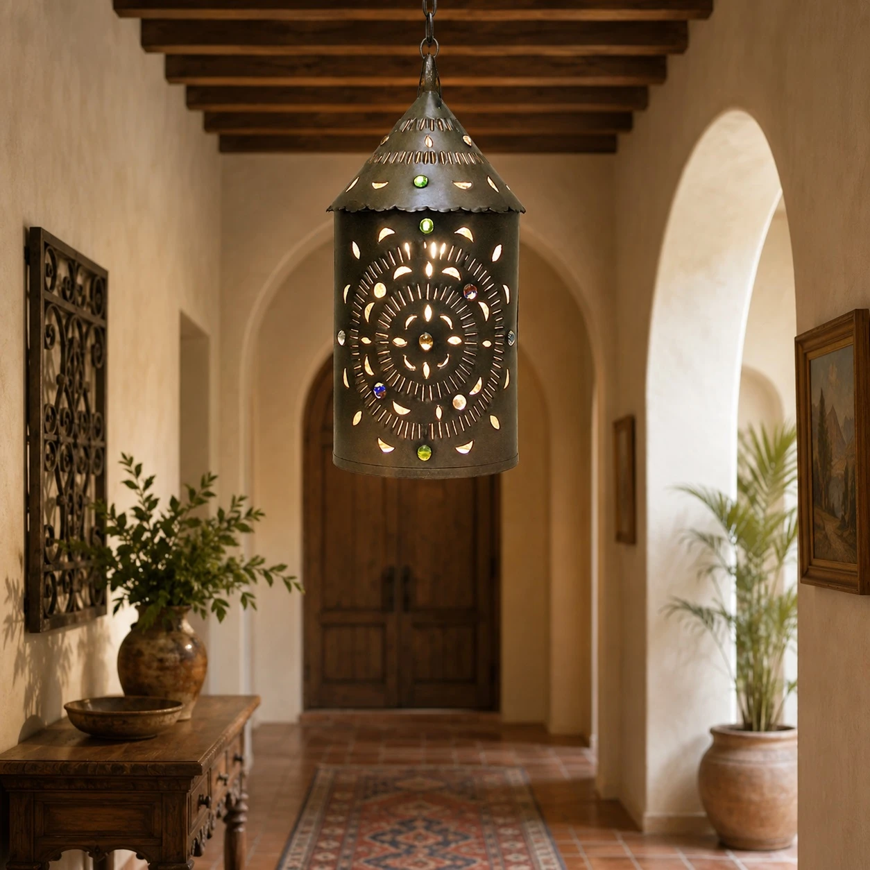 Mexican punched tin lantern with colorful glass crystals in a Spanish Revival hallway