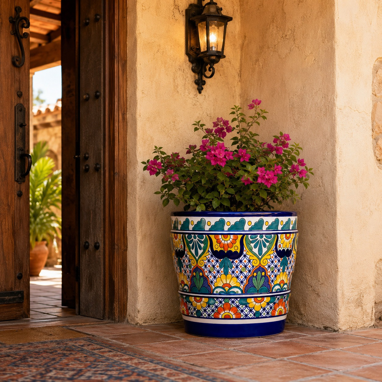 Mexican talavera pot with colorful floral pattern in a traditional hacienda entryway