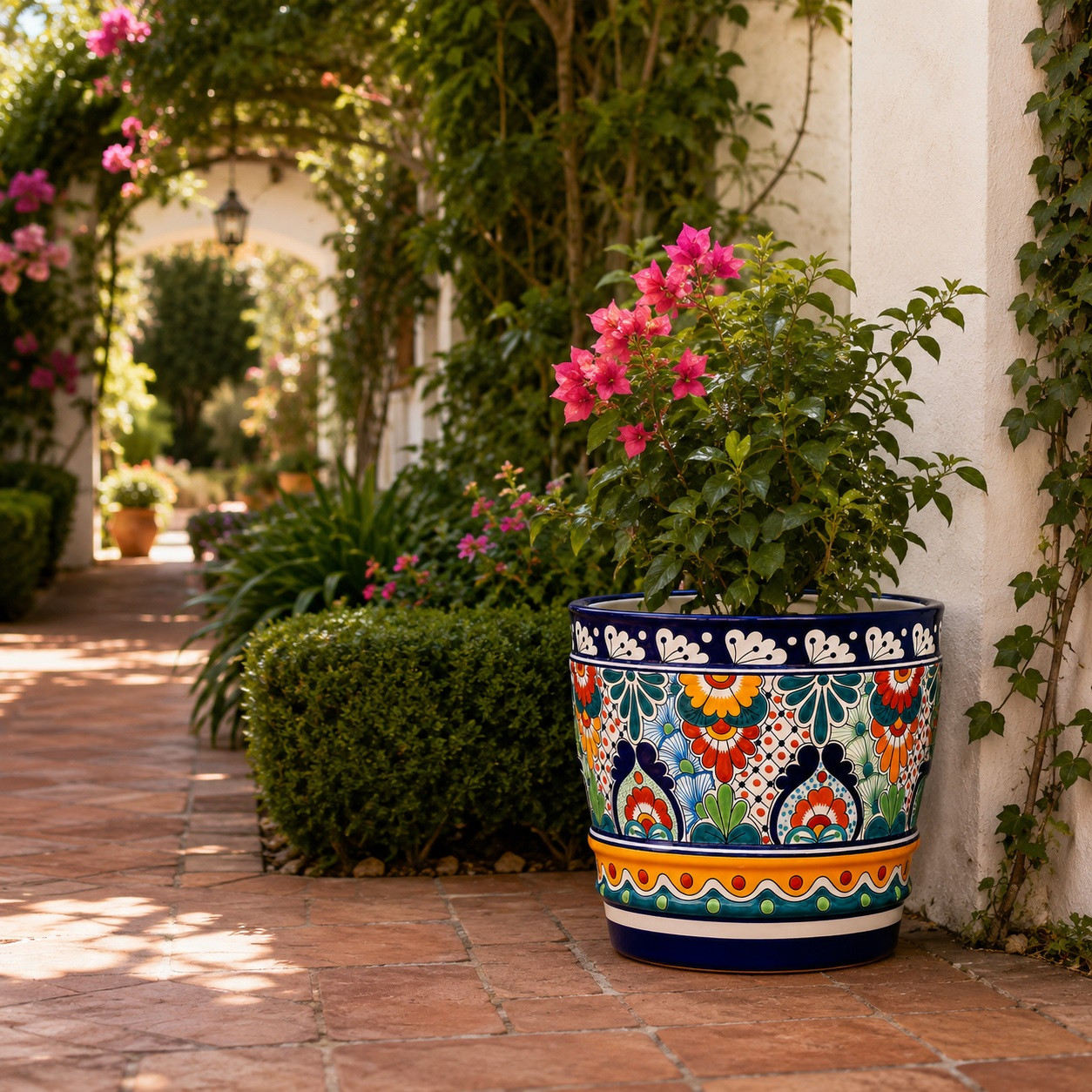 Mexican talavera pot - Teardrop floral medallions placed along a garden walkway