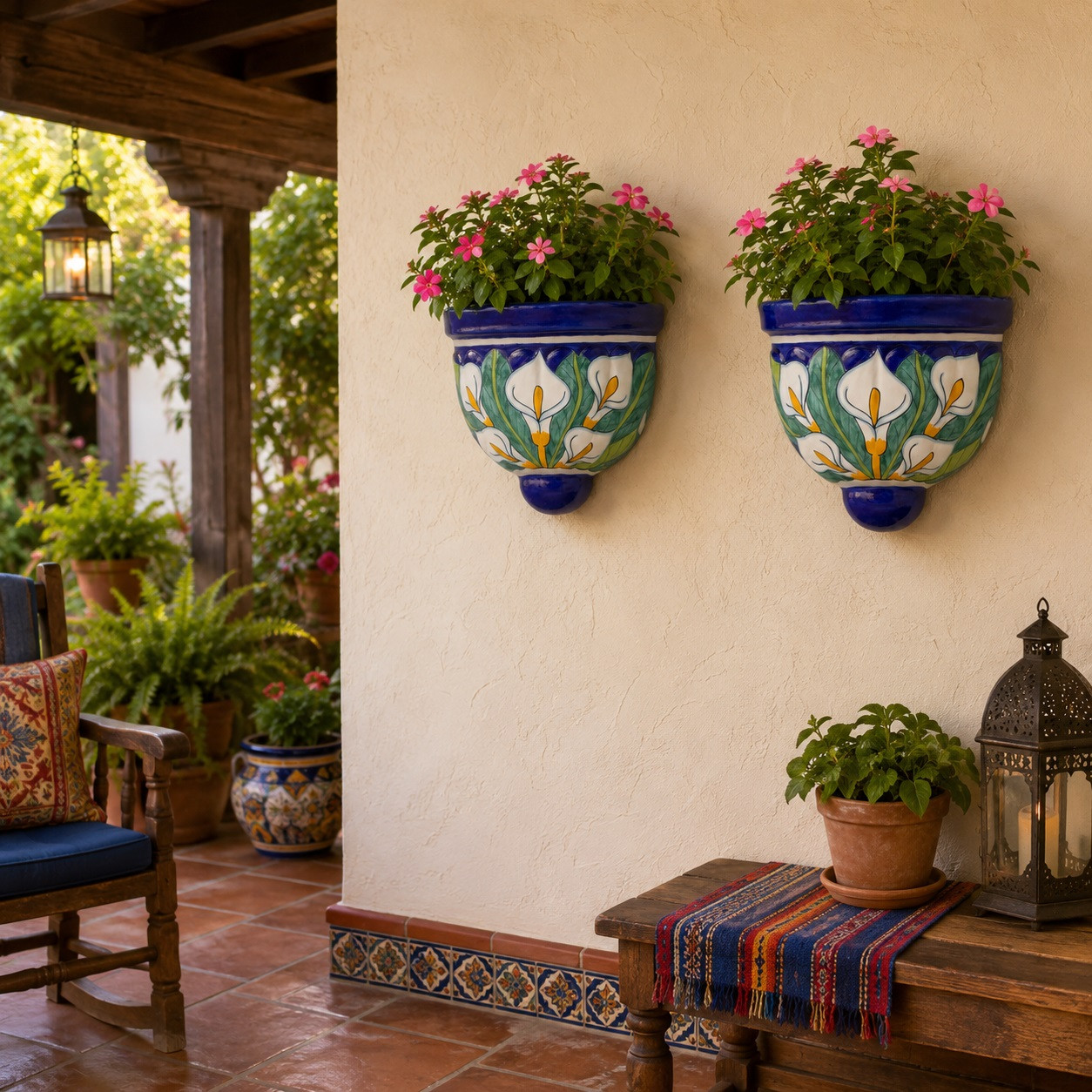 Two cobalt blue calla lily wall sconces with flowers on a warm covered porch