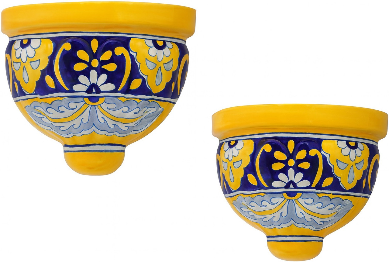 Two Mexican handcrafted wall sconces with yellow and cobalt design on white