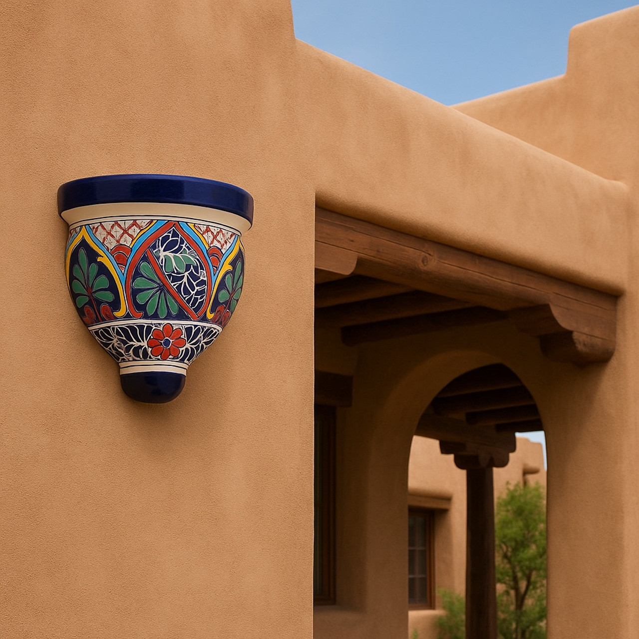 Cobalt trim Talavera wall sconce with lattice decortatiang Pueblo Revival house outside wall