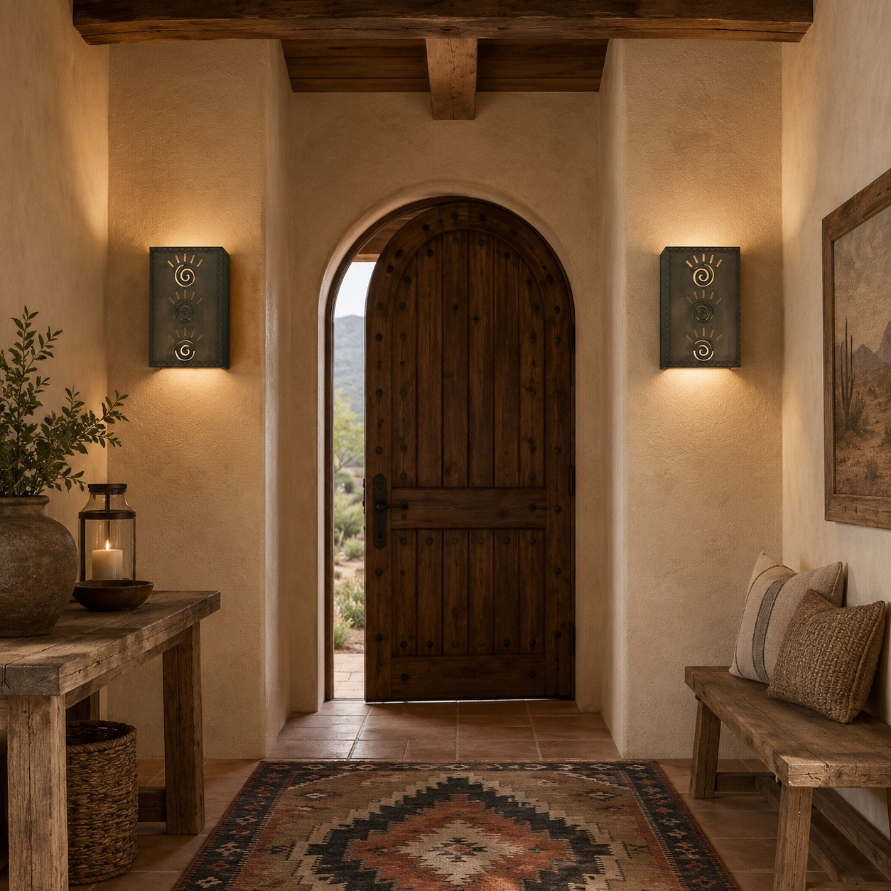 Two punched metal wall sconces with spiral sunburst cutouts in a warm rustic entryway