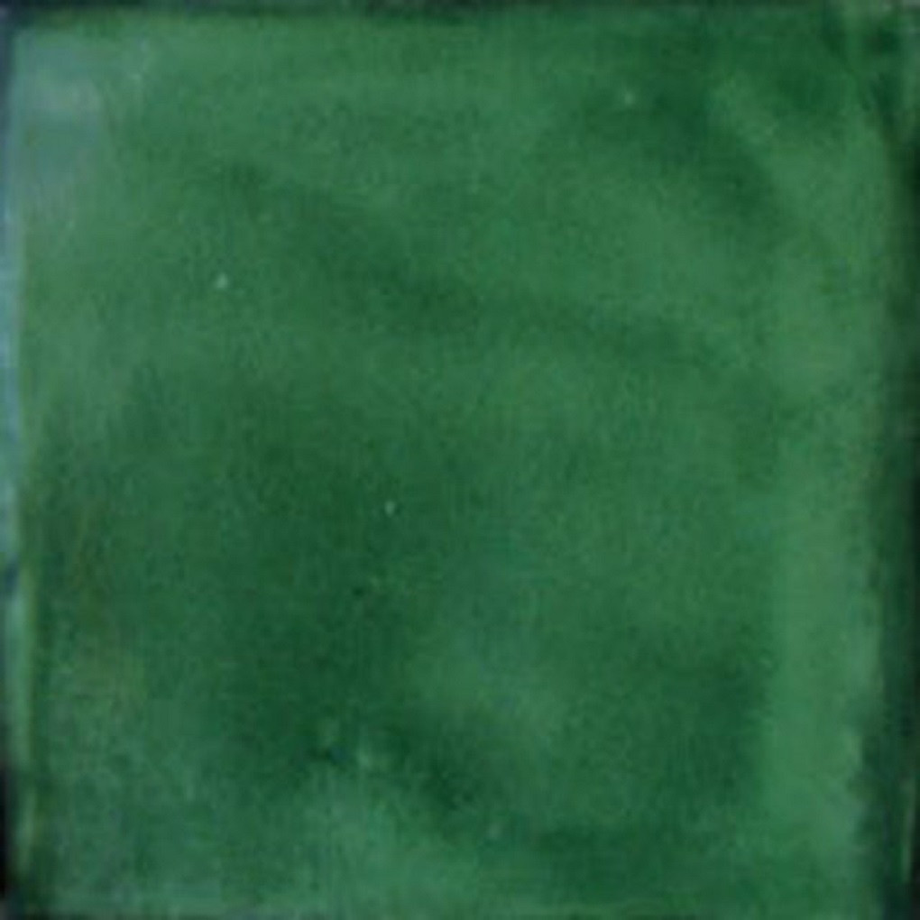 Washed green Mexican ceramic tile backsplash with rustic handcrafted glaze in a Mediterranean style kitchen