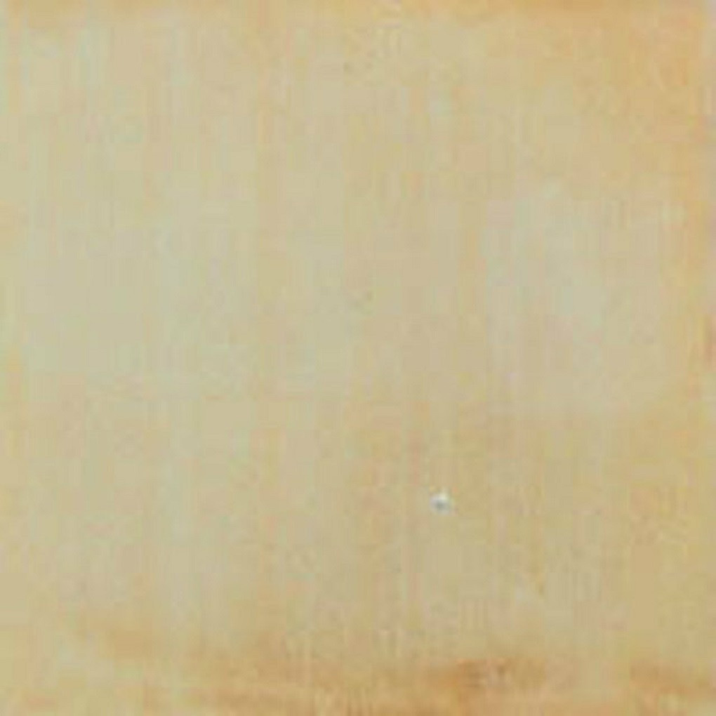 Beige Mexican ceramic tile backsplash with handcrafted finish in a rustic farmhouse kitchen setting