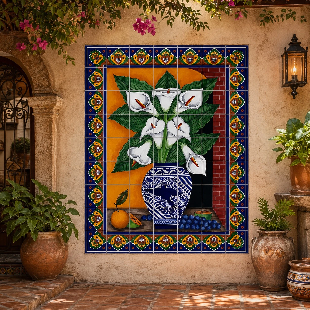 Talavera tile mural with calla lilies in a courtyard with rustic arches, pottery, and plants.