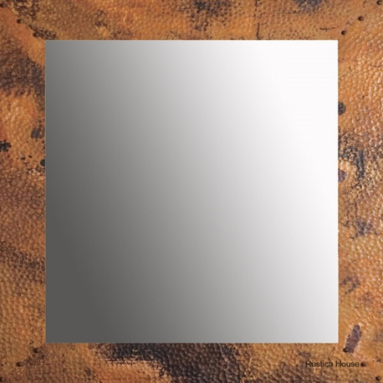 Front view of the Square Copper Mirror Mexicali, showcasing its hammered copper frame with an antique finish.