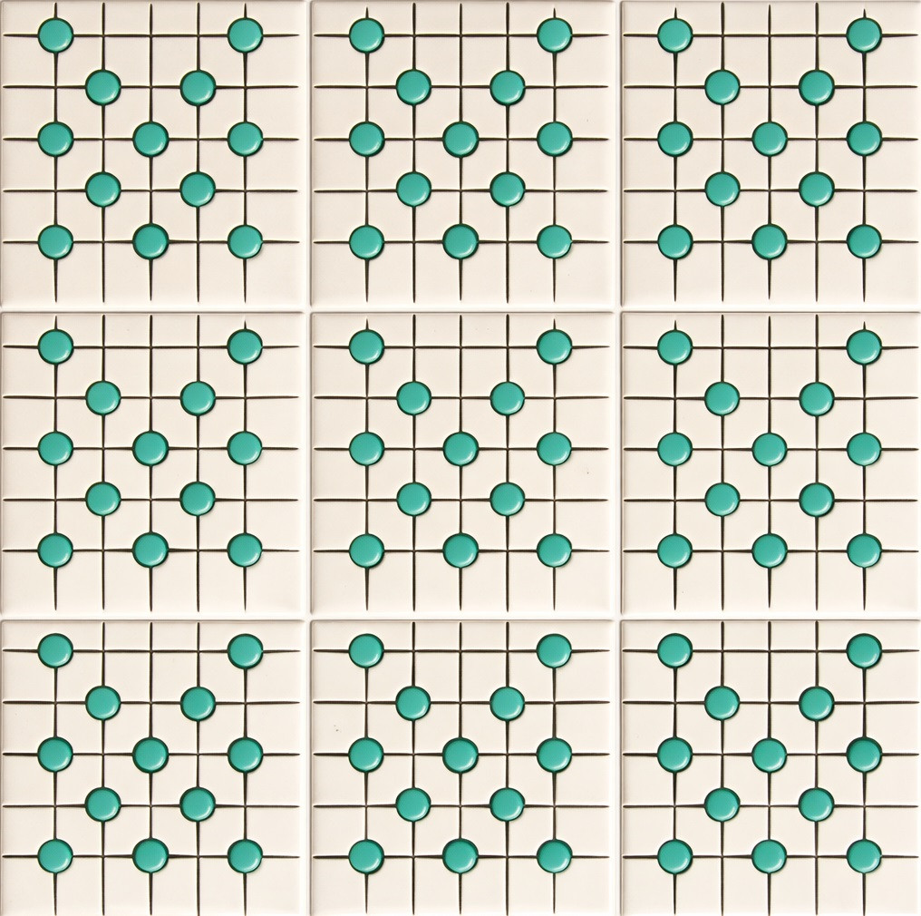 Mexican talavera relief tile turquoise dot grid showing nine identical relief tiles installed with light grout