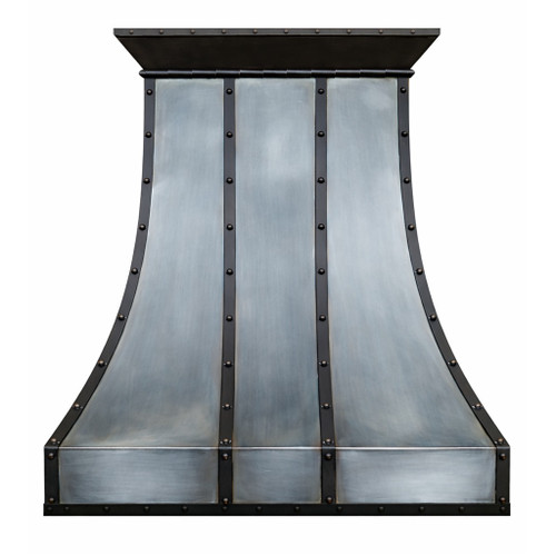 Loft style iron range hood with curved panels featuring a tall sculpted bell profile