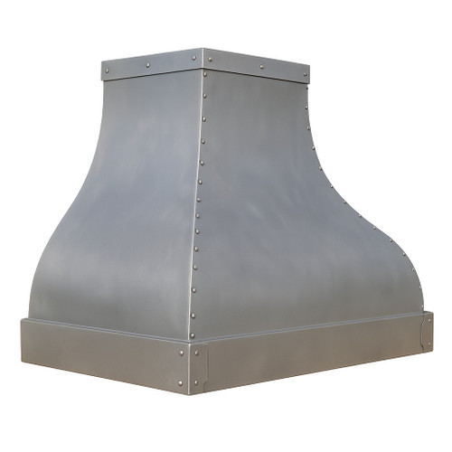 Zinc range hood with curved apron and rivet trim angled view showing patina and curved silhouette
