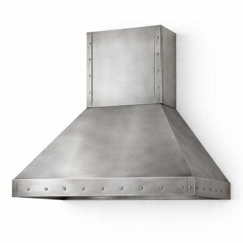 Angled view of a brushed zinc range hood with rivet trim and tapered canopy